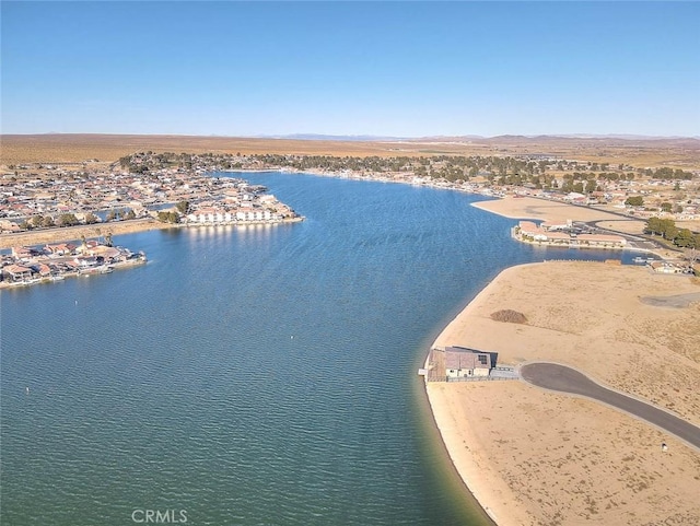 aerial view with a water view and a beach view