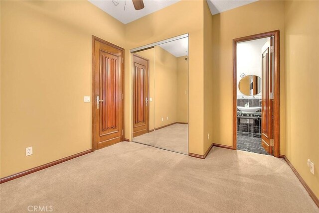 27008 Reef Ln, Helendale, CA 92342 - carpeted spare room featuring baseboards and a ceiling fan
