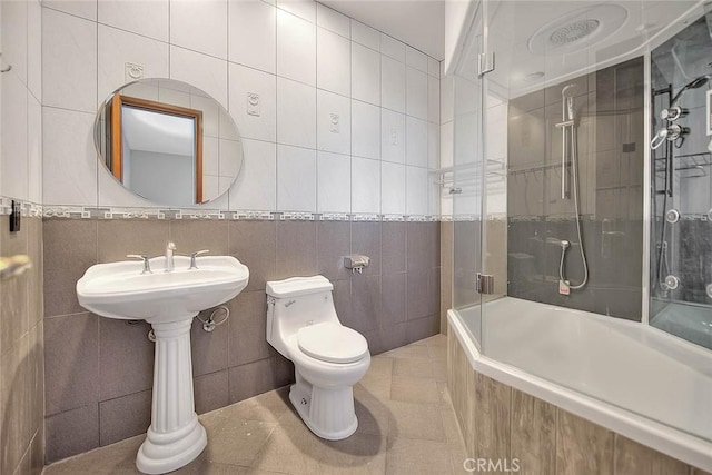 27008 Reef Ln, Helendale, CA 92342 - bathroom featuring tile walls, toilet, tile patterned floors, and tiled shower / bath