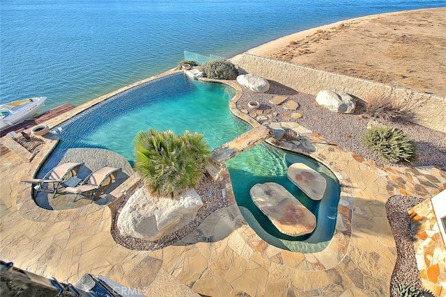 birds eye view of property with a water view