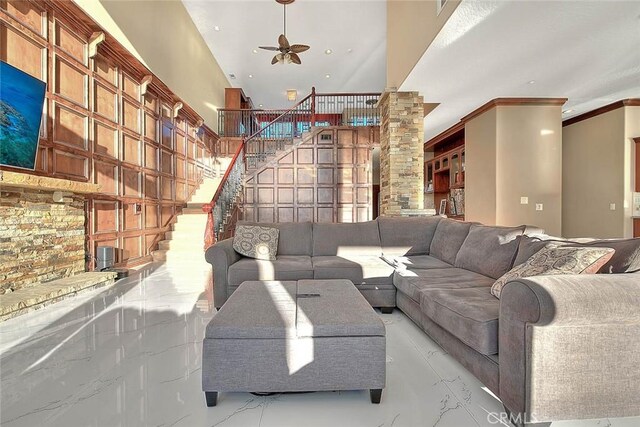 27008 Reef Ln, Helendale, CA 92342 - living area featuring a ceiling fan, stairway, and crown molding