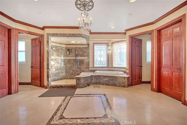 bathroom featuring a wealth of natural light, a notable chandelier, ornamental molding, and separate shower and tub