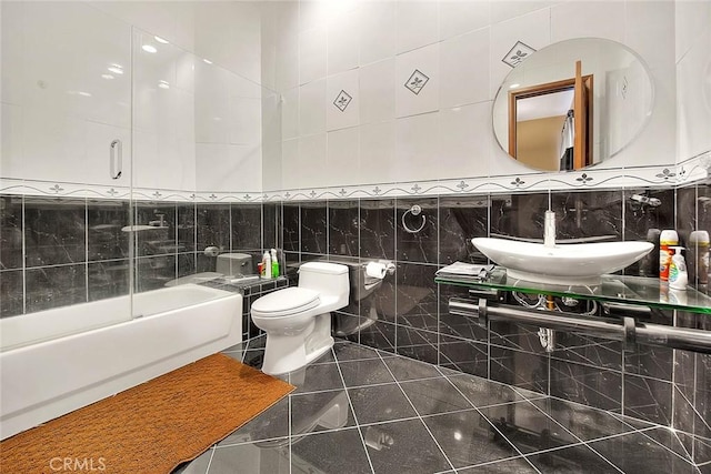 full bathroom with toilet, tile walls, tasteful backsplash, and sink