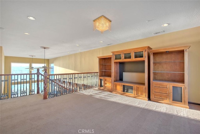 unfurnished living room featuring carpet