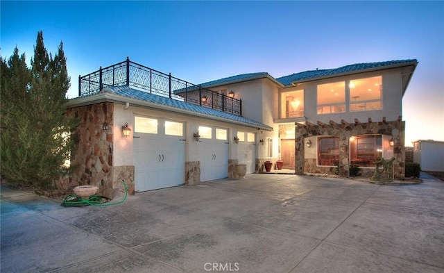 view of front of house featuring a balcony