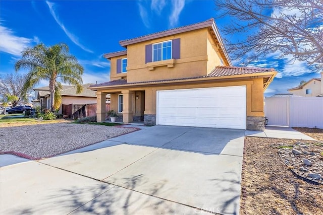 mediterranean / spanish-style home with a garage