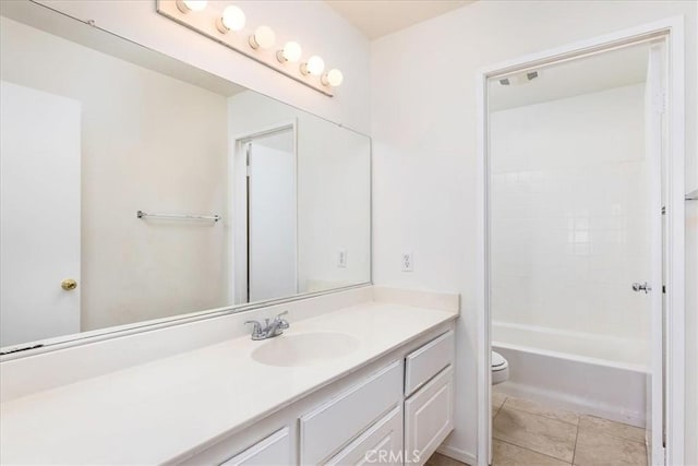 full bathroom with washtub / shower combination, toilet, vanity, and tile patterned flooring