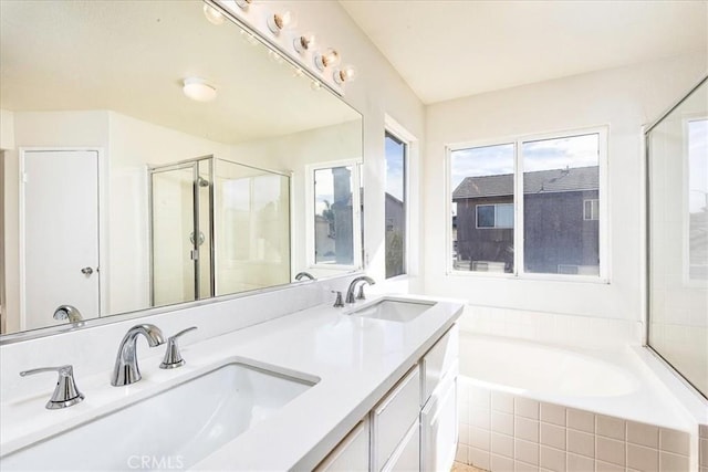 bathroom with separate shower and tub and vanity