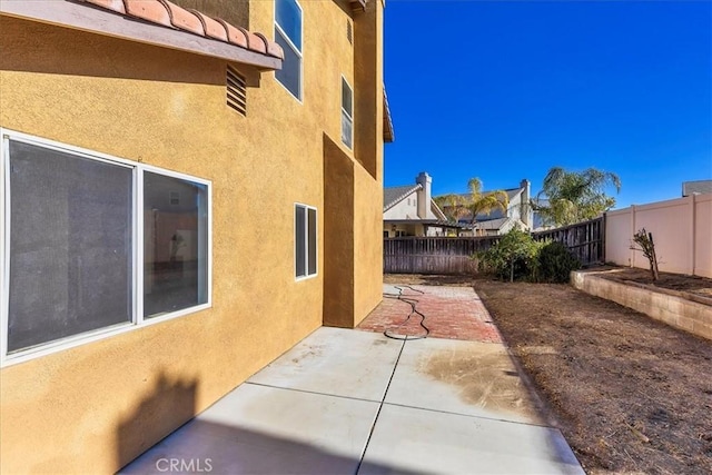 view of home's exterior featuring a patio area