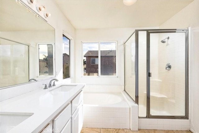 bathroom featuring vanity and plus walk in shower