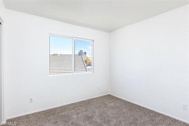 spare room featuring carpet