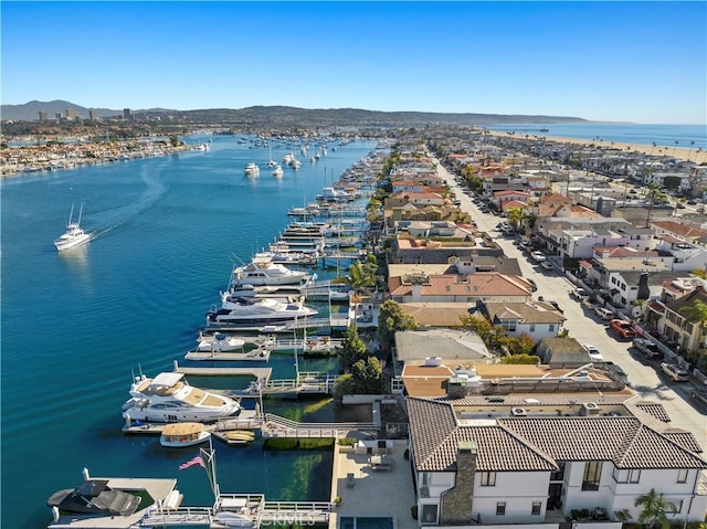 bird's eye view with a water and mountain view