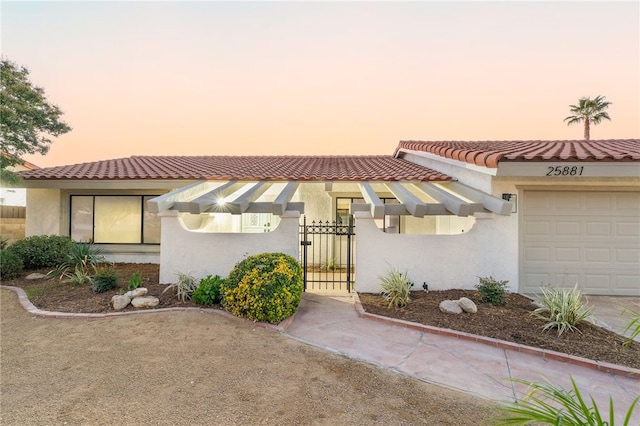 mediterranean / spanish-style home featuring a garage