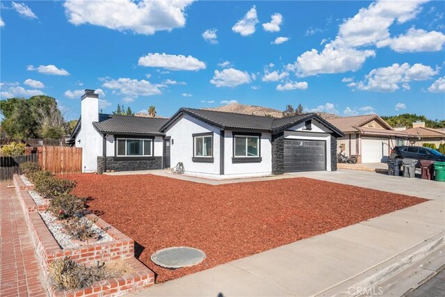 ranch-style house featuring a garage