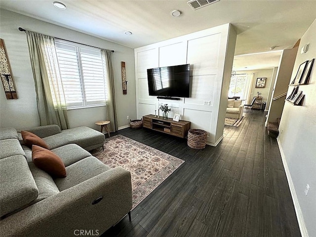 living room with dark hardwood / wood-style floors