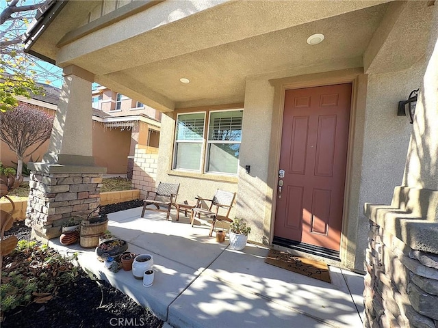 doorway to property featuring a patio