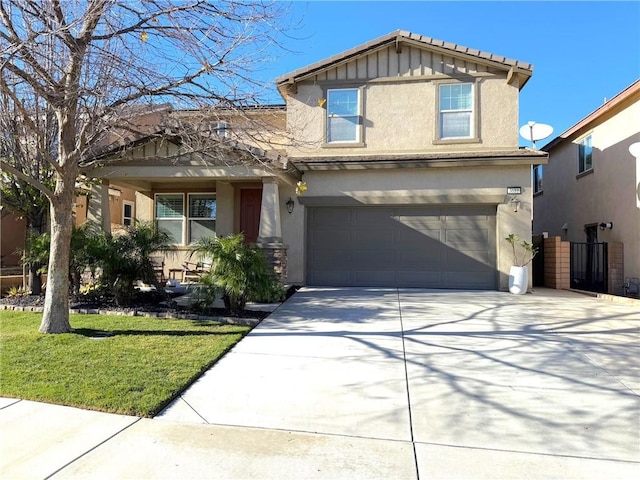 craftsman house featuring a front yard and a garage