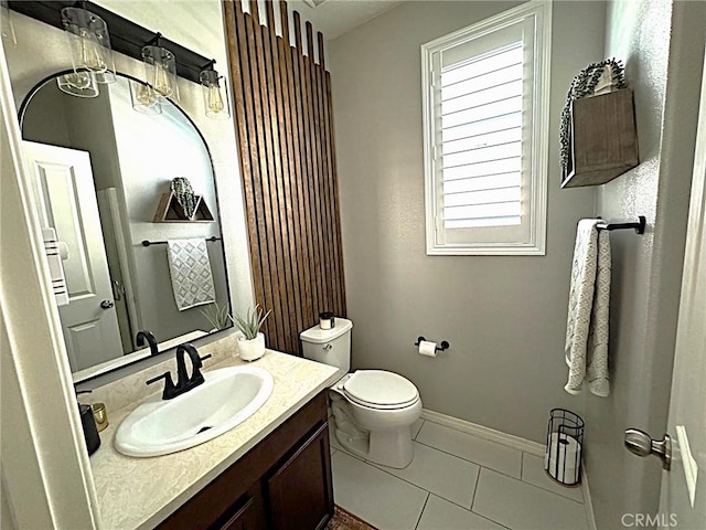 bathroom with vanity, tile patterned floors, and toilet