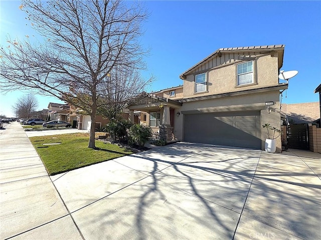 view of front of home featuring a front lawn and a garage