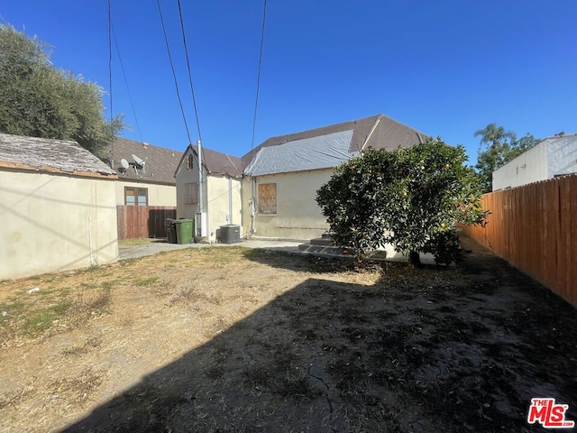 rear view of house with central AC