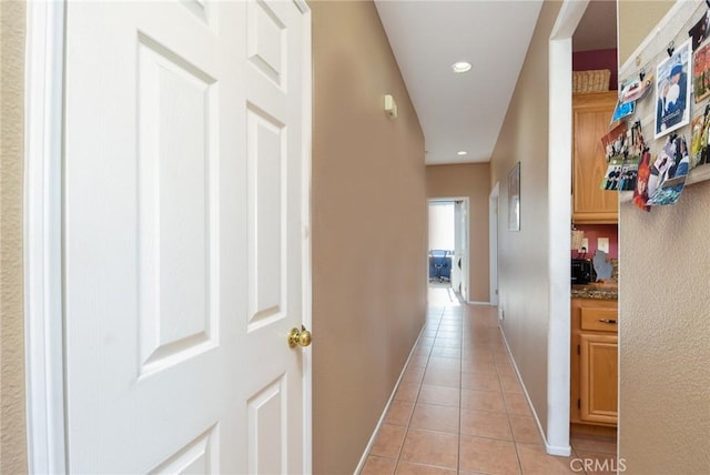 hallway featuring light tile patterned floors