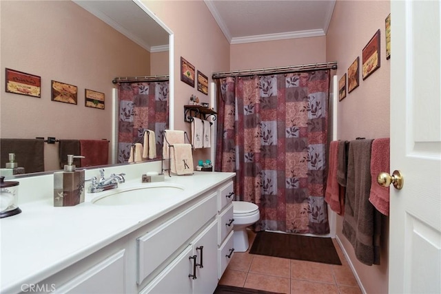 bathroom featuring toilet, vanity, tile patterned floors, and crown molding