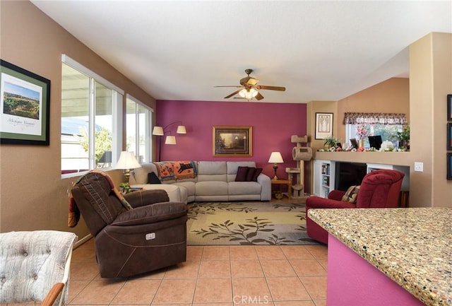 living room featuring ceiling fan and light tile patterned floors