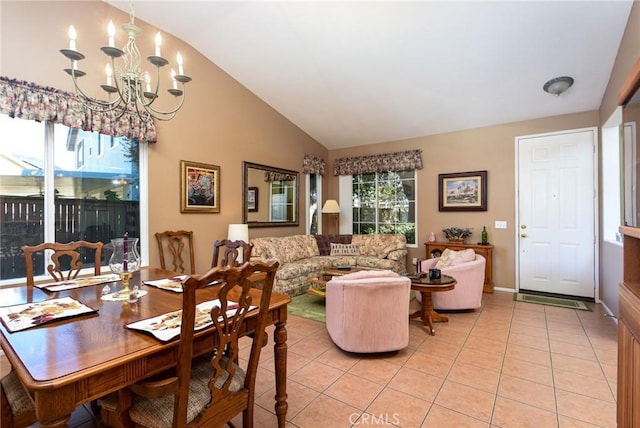 tiled dining room featuring lofted ceiling and an inviting chandelier