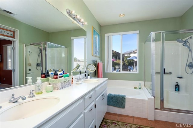 bathroom with vanity, tile patterned flooring, and shower with separate bathtub