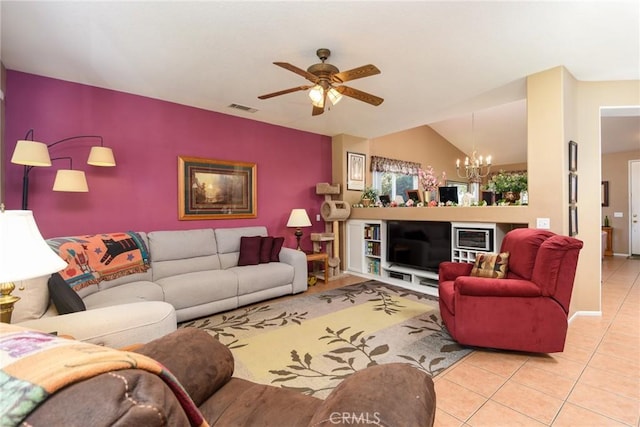 living room with vaulted ceiling, light tile patterned flooring, and ceiling fan with notable chandelier