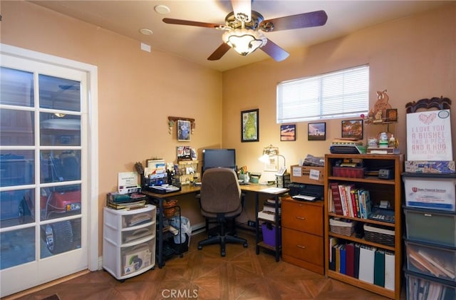 office area featuring ceiling fan and dark parquet floors