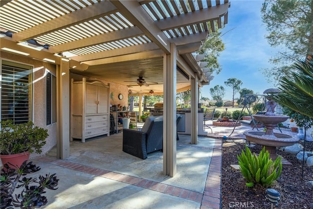 view of patio / terrace featuring a pergola and ceiling fan