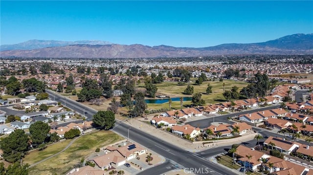 birds eye view of property featuring a water and mountain view