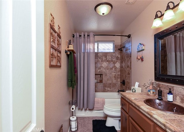 full bathroom featuring toilet, vanity, shower / tub combo with curtain, and a textured ceiling