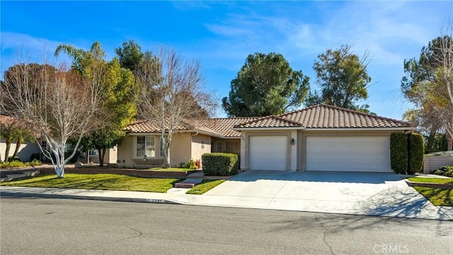 view of front facade with a front yard and a garage