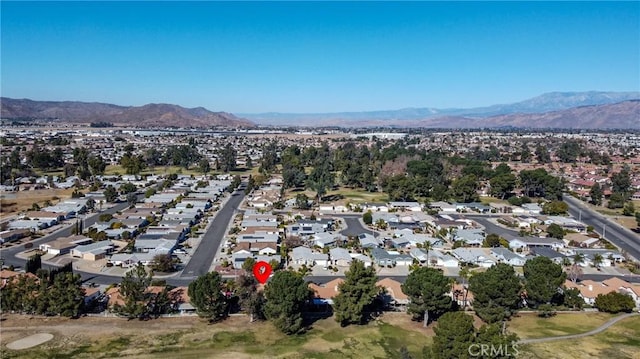 birds eye view of property featuring a mountain view