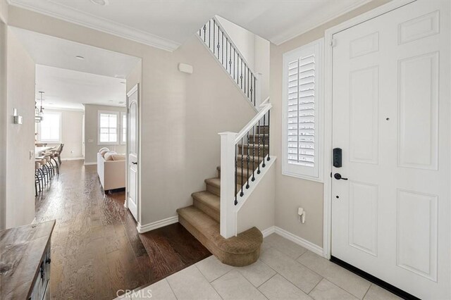 tiled entryway with crown molding