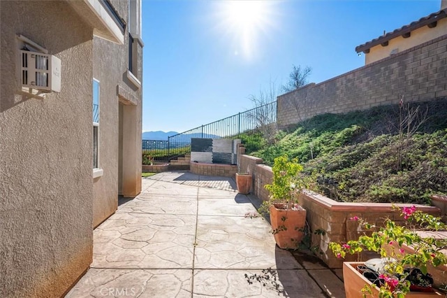 view of patio / terrace with a mountain view