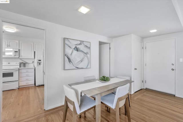 dining room with light hardwood / wood-style floors