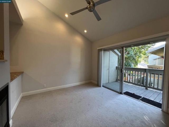 unfurnished living room featuring ceiling fan, high vaulted ceiling, and light carpet