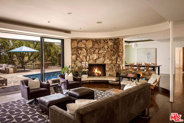 living room with a fireplace and hardwood / wood-style flooring