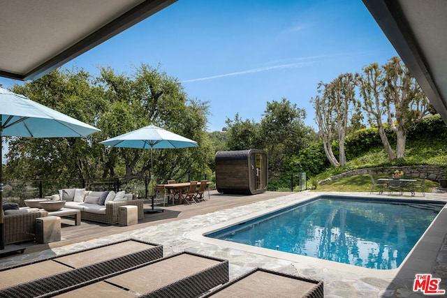 view of swimming pool with outdoor lounge area