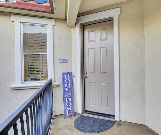 property entrance with a balcony