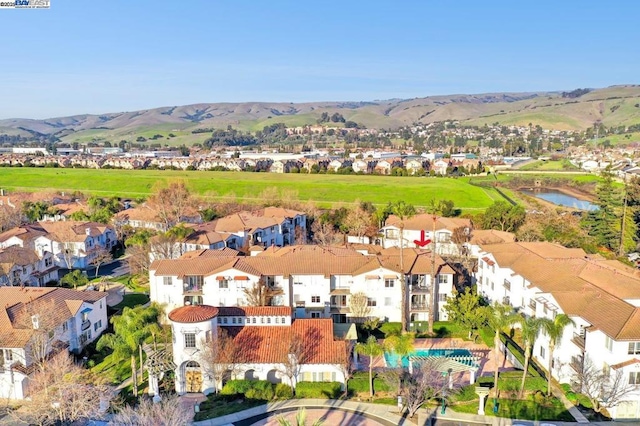 birds eye view of property featuring a water and mountain view