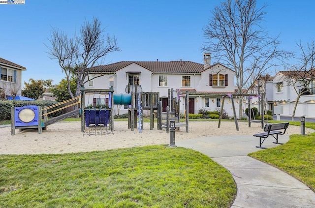 exterior space featuring a playground and a lawn