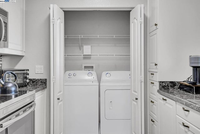 washroom with independent washer and dryer