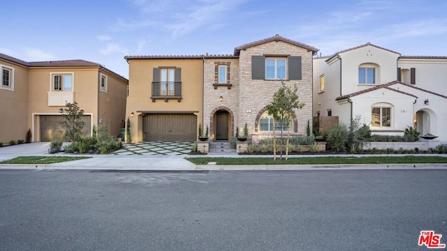 mediterranean / spanish house featuring a garage