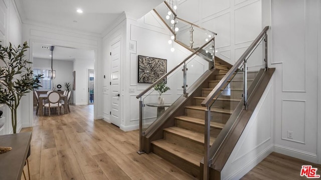 stairs featuring hardwood / wood-style flooring