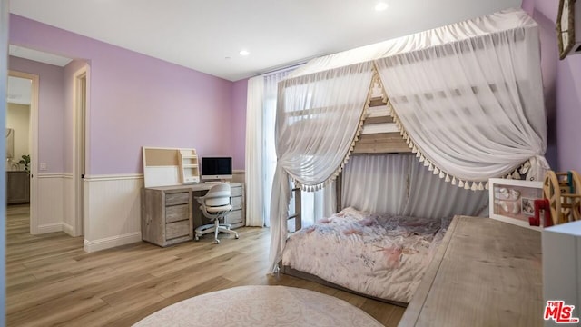 bedroom with light wood-type flooring