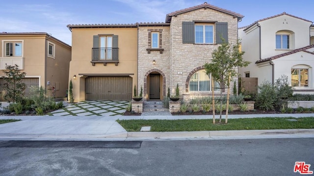 mediterranean / spanish-style house featuring a garage